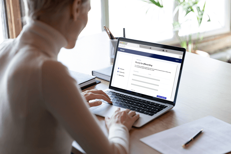 A mortgage professional with an open laptop preparing an eRecording on the Stavvy platform A mortgage professional with an open laptop preparing an eRecording on the Stavvy platform